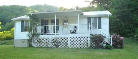 Enjoy the front porch while listening to the birds sing........