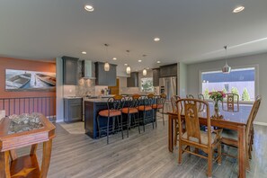 The spacious kitchen, dining and living room allow for large group gatherings.