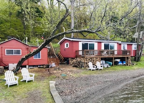 The main house (right) and hand-built wood cottage (left)