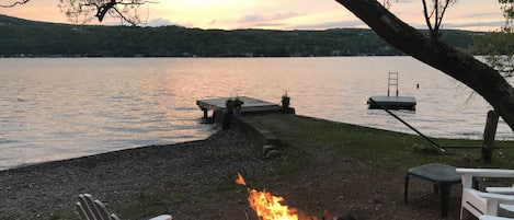 Enjoy amazing sunset views from the fire pit on the shale beach