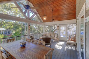 Screened in porch with Dining and Seating with vaulted ceiling