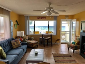 Living room  view showing beach view and balcony access.