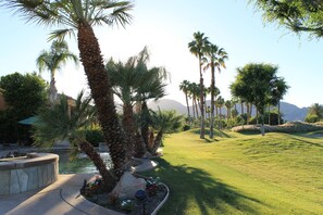 The 17th hole is just to the right, mountains and palms create a beautiful view.