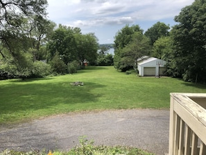 Two acre lawn w/ fire pit goes down to beach in the distance