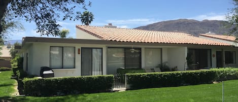 View of the back patio and mountains from the  golf course