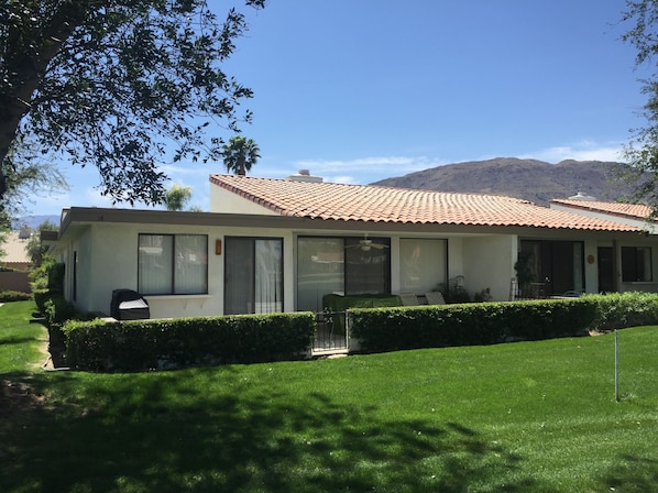 View of the back patio and mountains from the  golf course