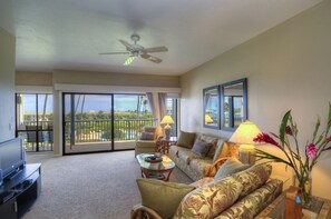 Ample size living room looking out to the pool