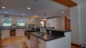 Granite countertops, stainless steel appliances and hardwood floors.