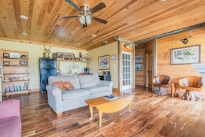 Living room, gray couch opens to full size bed.