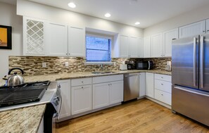 Large kitchen with under counter lighting