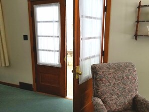 The living room doors lead to a lovely screened-in porch for enjoying a lazy day