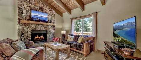 Living room with stone fireplace where you can enjoy a warm cozy fire.