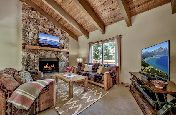 Living room with stone fireplace where you can enjoy a warm cozy fire.