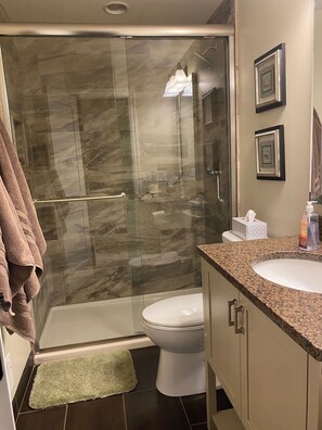 Upper bath remodeled w/granite and tile. 