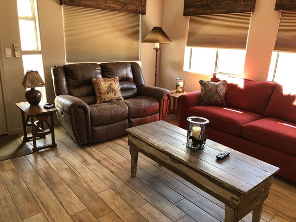 Living area. The red couch is a queen size hide a bed.
