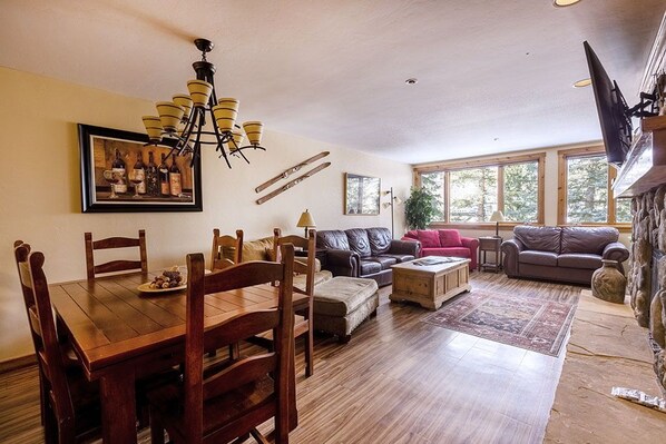 Great room, dining area, and fireplace.