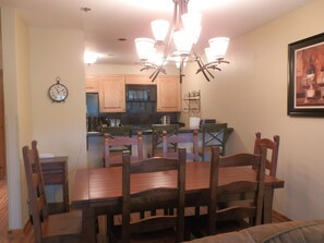 Dining Area. Table seats 6 and high bar seats 3.