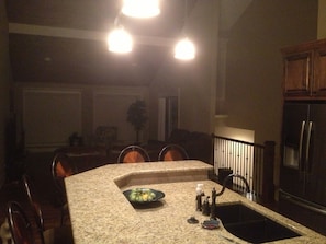 Kitchen looking into main floor living room