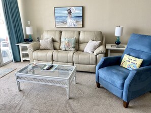Leather reclining sofa and two reclining chairs.