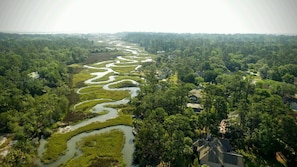 The beautiful marsh winds behind our home keeping us cool and bug free.