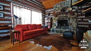 The couch in the living room converts to a queen bed. Enjoy the fireplace!