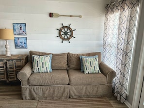 Nautical décor and a La-Z-Boy sofa in the living room