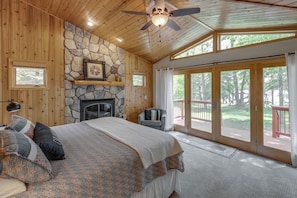 Primary bedroom suite has spectacular lakeside views and private bathroom