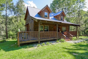 Wrap around balcony offers treetop view of brook, flora, and fauna. 