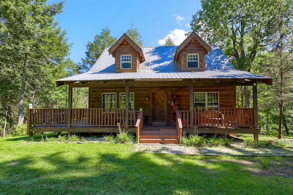 Hand build timber frame cabin made from wood lumbered on site.