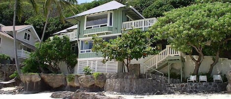 Front view of the house from secluded white sandy beach
