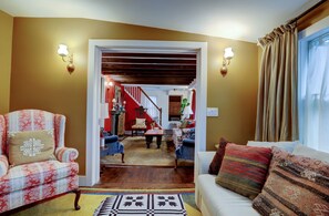 Media Room / Guest Room with Pocket Doors and Living Room in the Distance