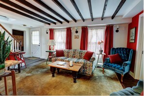 Living Room with Sofa and Coffee Table, Vintage Side Tables and Wingback Chairs