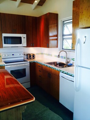 Kitchen with modern appliances and bamboo cabinets