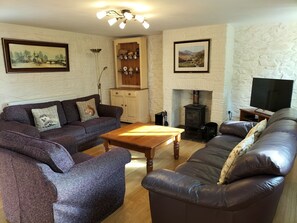 The cottage has central heating throughout and a log burner in the cosy lounge.