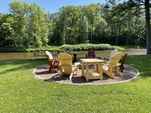 Large outdoor firepit with seating for 8.