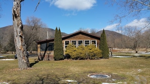 A Beautiful Cabin from Pine Creek. Fire ring in yard.