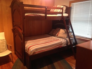 Full on bottom bunk beds. Some games and extra linens. 