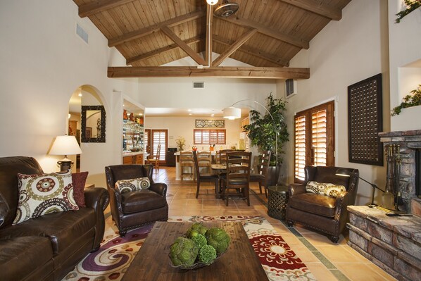 Living room, game table and bar looking into kitchen