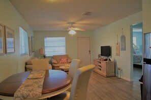 Dining table is wood with leather chairs