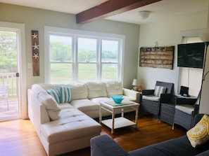 Water views from living room are breathtaking! Sliding door to deck.