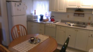 Full kitchen with dishwasher and appliances