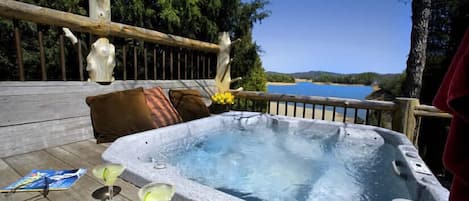 Relax in the jacuzzi + Enjoy the views of Douglas Lake right outside your door.