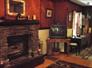 Cozy wood burning fireplace, tv has been replaced with flat screen