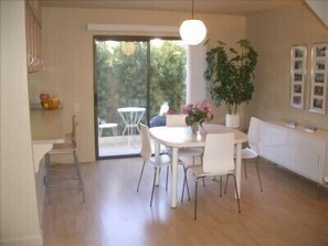 Dining Room with open kitchen and private back patio
