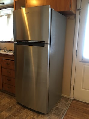 Older kitchen, new frig, fully stocked for light cooking & meal prep, coffee 