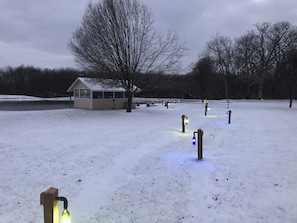 Walk the lighted path to the fire pit or newly completed dock.