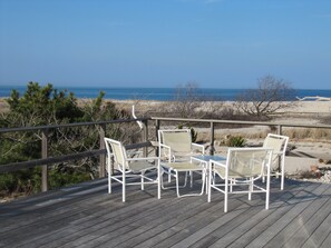 Large deck w/ 2 dining tables - largest readily seats 12 - and 2 lounge chairs