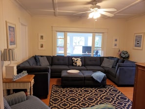 Living room with seating for at least 10 people.