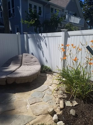 Quaint backyard with grill and hammock