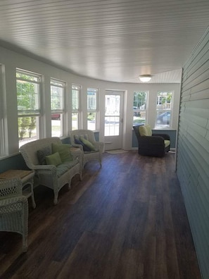 Large wrap-around screened in front porch